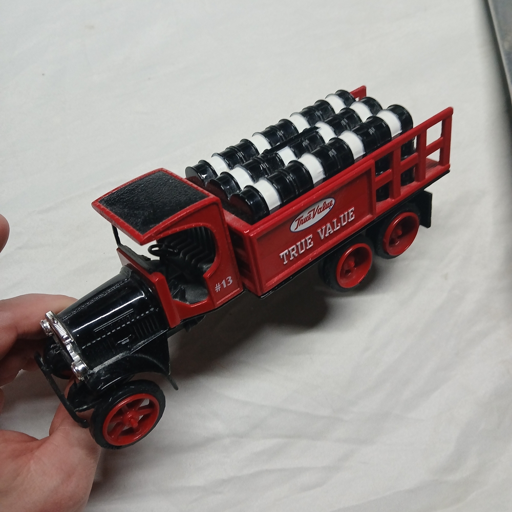 Ertl 1925 Kenworth True Value Hardware die-cast stake truck coin bank.